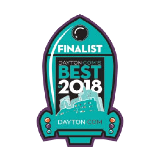 Badge-shaped emblem indicating "Finalist, Dayton.com's Best of 2018," with the silhouette of a cityscape and website URL "DAYTON.COM.