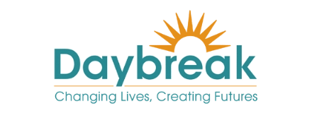 Daybreak logo with a sun graphic above the word "Daybreak" and the tagline "Changing Lives, Creating Futures" below.